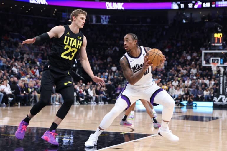 Oct 29, 2024; Salt Lake City, Utah, USA; Sacramento Kings forward DeMar DeRozan (10) steps back to shoot against Utah Jazz forward Lauri Markkanen (23) during the first quarter at Delta Center. Mandatory Credit: Rob Gray-Imagn Images