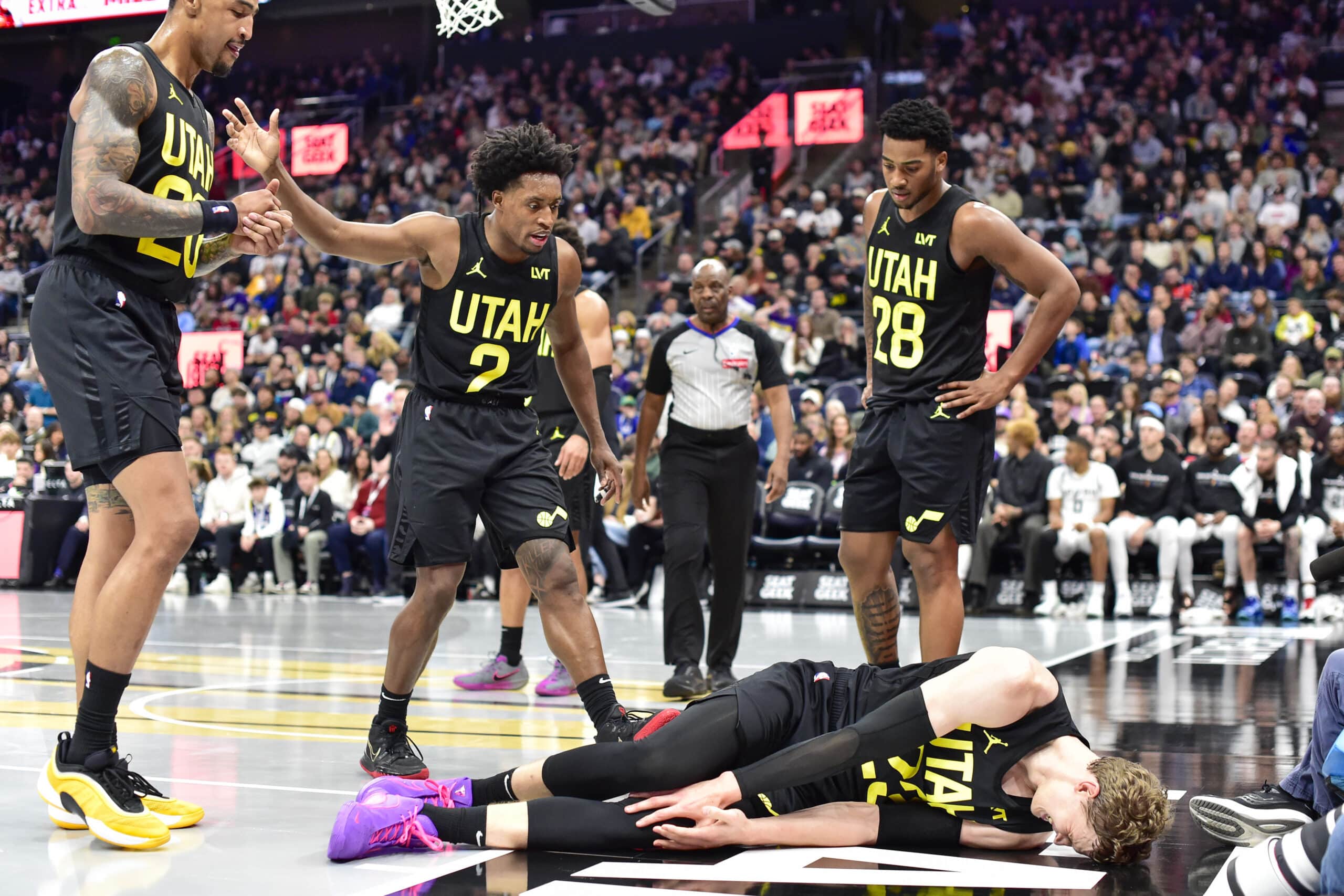 Nov 26, 2024; Salt Lake City, Utah, USA; Utah Jazz forward/center Lauri Markkanen (23) on the floor after a collision with San Antonio Spurs forward/center Victor Wembanyama (1) during the second half at Delta Center. Mandatory Credit: Christopher Creveling-Imagn Images