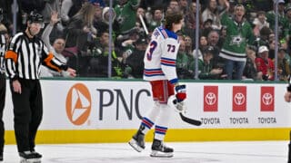Dec 20, 2024; Dallas, Texas, USA; New York Rangers center Matt Rempe (73) leaves the game after receiving a game misconduct for an elbow on Dallas Stars defenseman Miro Heiskanen (not pictured) during the third period at the American Airlines Center. Mandatory Credit: Jerome Miron-Imagn Images