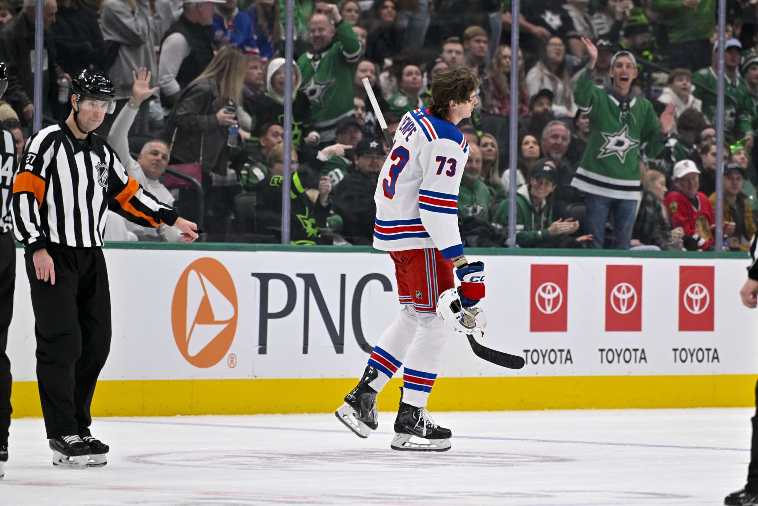 Dec 20, 2024; Dallas, Texas, USA; New York Rangers center Matt Rempe (73) leaves the game after receiving a game misconduct for an elbow on Dallas Stars defenseman Miro Heiskanen (not pictured) during the third period at the American Airlines Center. Mandatory Credit: Jerome Miron-Imagn Images