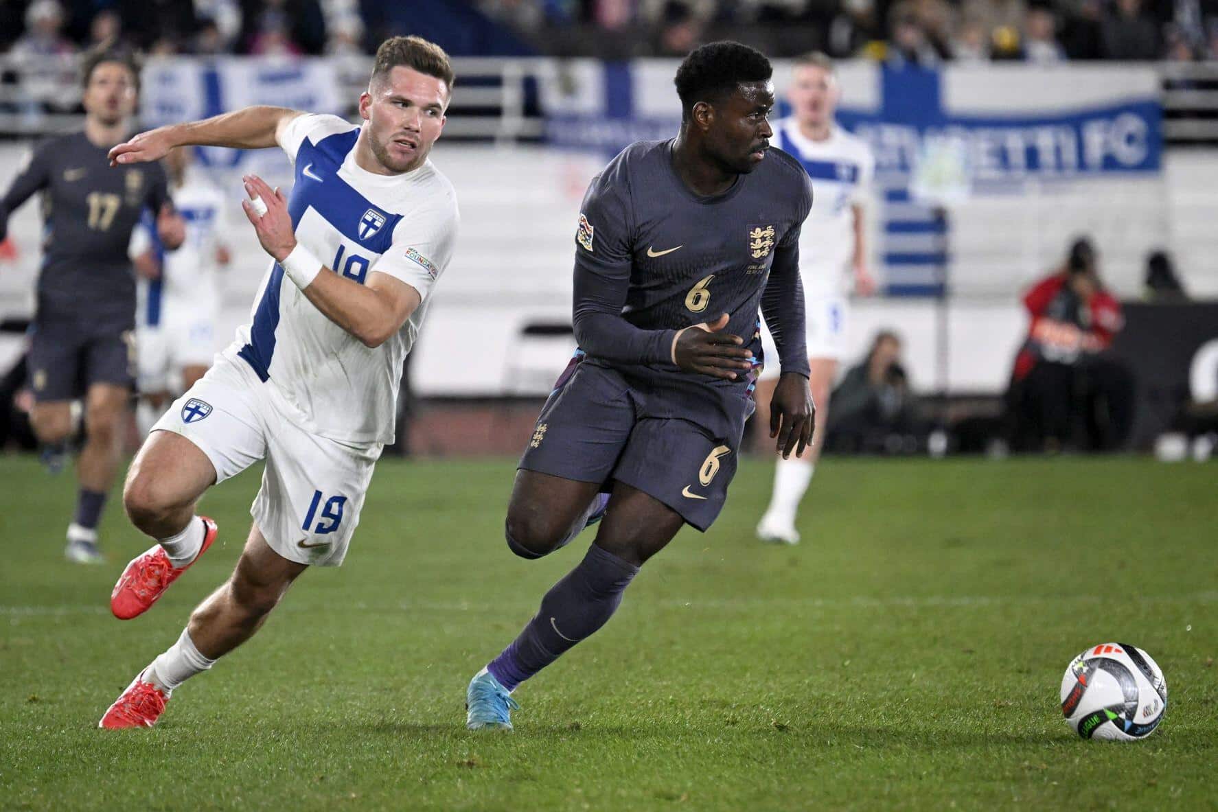 Benjamin Källman (L) of Finland vies with Marc Guehi of England during the UEFA Nations League, League B - Group 2, football match between Finland and England at the Olympic Stadium in Helsinki, Finland, on October 13, 2024. (Photo by MARKKU ULANDER/LEHTIKUVA/Sipa USA/News Images)