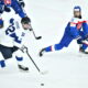 epa11053506 Finland's Emil Hemming (R) and Slovakia's Luka Radivojevic (R) in action during the IIHF 2024 World Junior Championship quarterfinals ice hockey match between Slovakia and Finland, in Gothenburg, Sweden, 02 January 2024.  EPA-EFE/Björn Larsson Rosvall  SWEDEN OUT