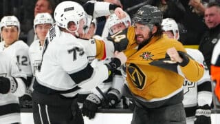 Mar 9, 2025; Las Vegas, Nevada, USA; Los Angeles Kings center Samuel Helenius (79) fights Vegas Golden Knights defenseman Nicolas Hague (14) during the second period at T-Mobile Arena. Mandatory Credit: Stephen R. Sylvanie-Imagn Images