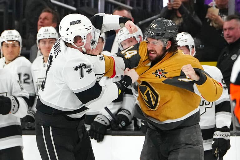 Mar 9, 2025; Las Vegas, Nevada, USA; Los Angeles Kings center Samuel Helenius (79) fights Vegas Golden Knights defenseman Nicolas Hague (14) during the second period at T-Mobile Arena. Mandatory Credit: Stephen R. Sylvanie-Imagn Images