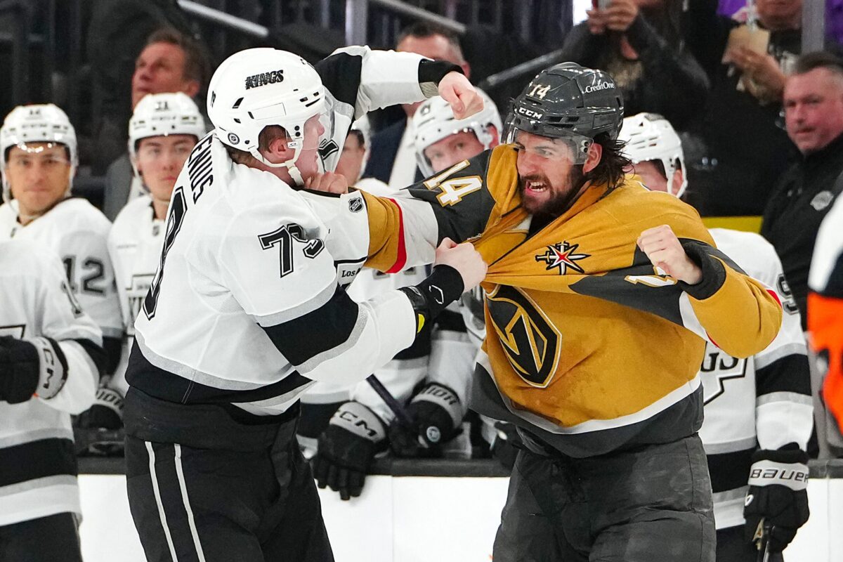 Mar 9, 2025; Las Vegas, Nevada, USA; Los Angeles Kings center Samuel Helenius (79) fights Vegas Golden Knights defenseman Nicolas Hague (14) during the second period at T-Mobile Arena. Mandatory Credit: Stephen R. Sylvanie-Imagn Images