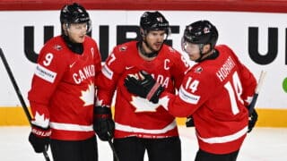 epa12097688 Canada's Sidney Crosby (C) celebrates scoring the 3-0 goal with his teammates Canada's Nate MacKinnon (L) and Bo Horvat (R) during the 2025 IIHF Ice Hockey World Championship group A match between Canada and France, in Stockholm, Sweden, 13 May 2025.  EPA-EFE/Anders Wiklund  SWEDEN OUT