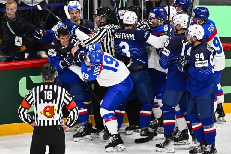 epa12100059 France's Jordann Perret (2-L) in a fight with Slovakia's Patrik Hrehorcak (3-L #19) during the 2025 IIHF Ice Hockey World Championship group A match between Slovakia and France, in Stockholm, Sweden, 14 May 2025.  EPA-EFE/Anders Wiklund  SWEDEN OUT