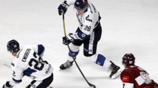 epaselect epa12023318 Finland's Tommi Tikka (C) in action during the friendly international ice hockey match between Latvia and Finland in Riga, Latvia, 10 April 2025.  EPA-EFE/TOMS KALNINS