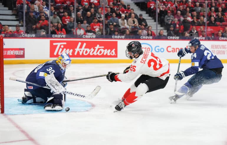XXIIHFXX  KANATA, ONTARIO - DECEMBER 26: Finland's Petteri Rimpinen #30 makes a pad save against Canada's Matthew Schaefer #25 while Jesse Nurmi #24 defends during Preliminary Round - Group A action at 2025 IIHF World Junior Championship at Canadian Tire Centre on December 26, 2024 in Kanata, Ontario, Canada. (Photo by André Ringuette/IIHF) 
All Over Press