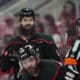 May 20, 2025; Raleigh, North Carolina, USA; Carolina Hurricanes defenseman Brent Burns (8) and forward Jordan Martinook (48) look on during the third period against the Florida Panthers in game one of the Eastern Conference Final of the 2025 Stanley Cup Playoffs at Lenovo Center. Mandatory Credit: James Guillory-Imagn Images