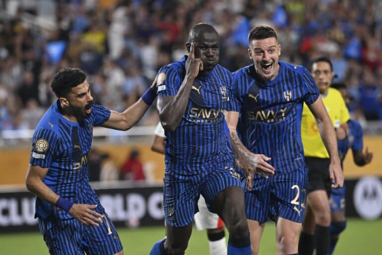 epa12207454 Kalidou Koulibaly of Al Hilal (C) celebrates his goal with Ali Lajami of Al Hilal (L) and Sergej Milinkovic-Savic of Al Hilal (R) during the first extra time period of the FIFA Club World Cup 2025 match between Manchester City and Al Hilal in Orlando, Florida, USA, 30 June 2025.  EPA/MIGUEL RODRIGUEZ